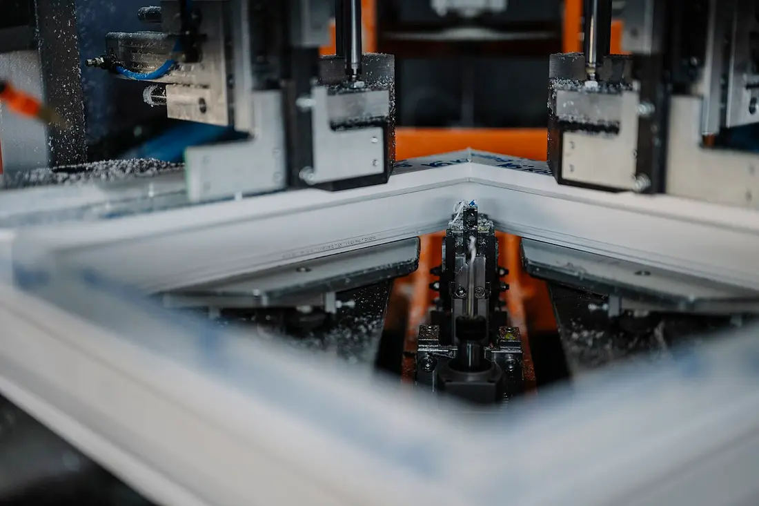 Machinery shaping metal components on a factory production line